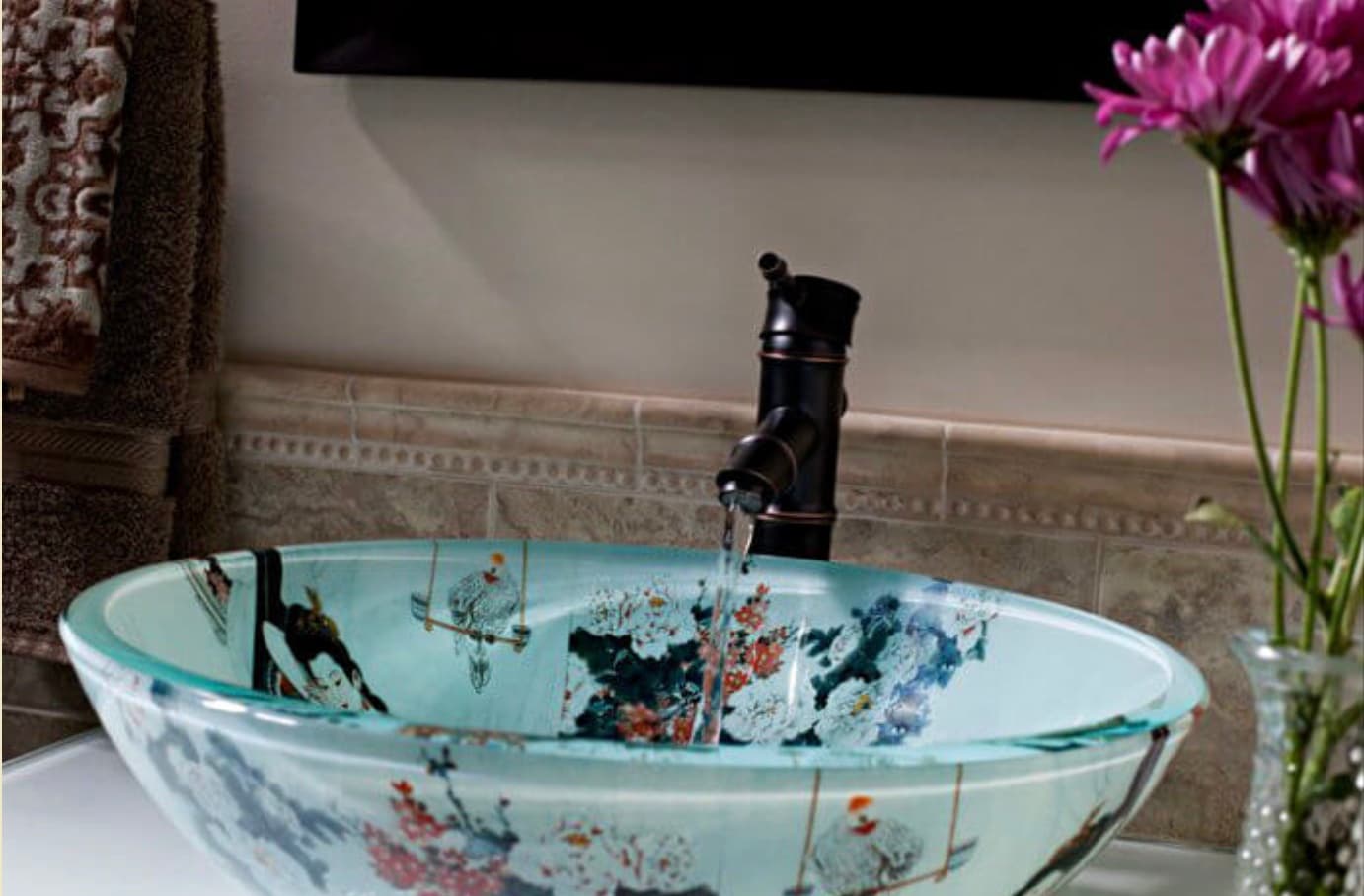 Beautiful teal ornate bathroom sink with water flowing