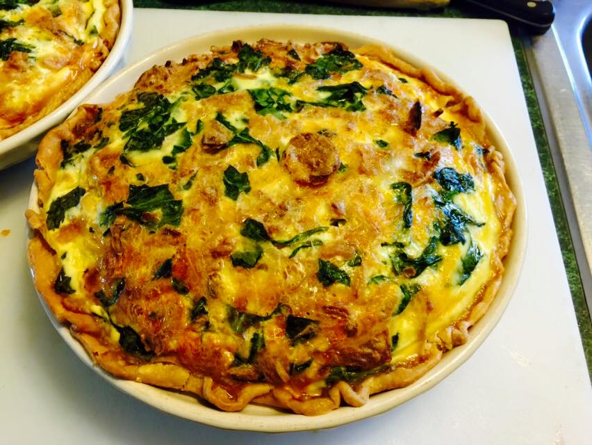 Freshly baked spinach and cheddar quiche