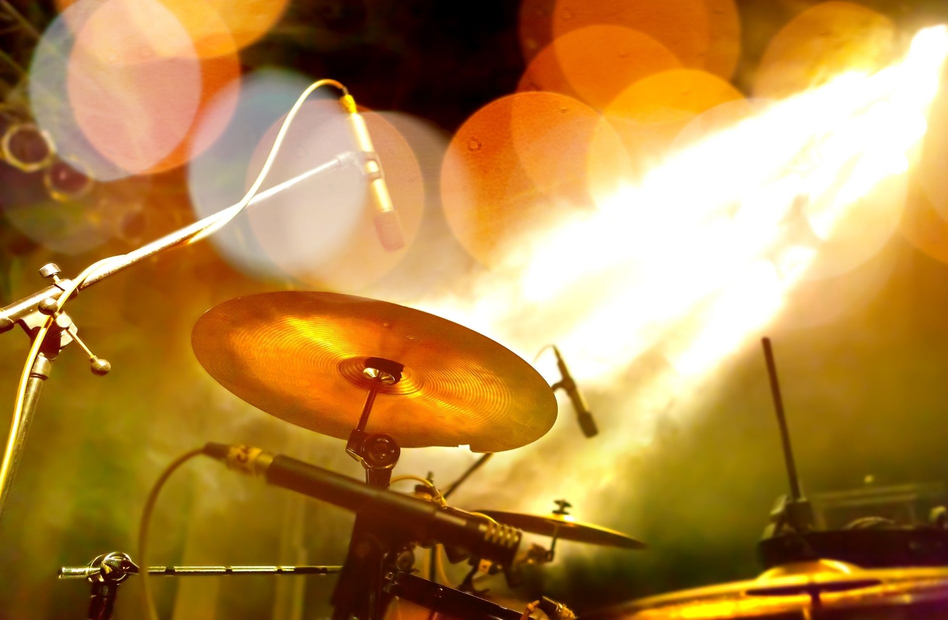 Drum set on a stage surrounded by lights