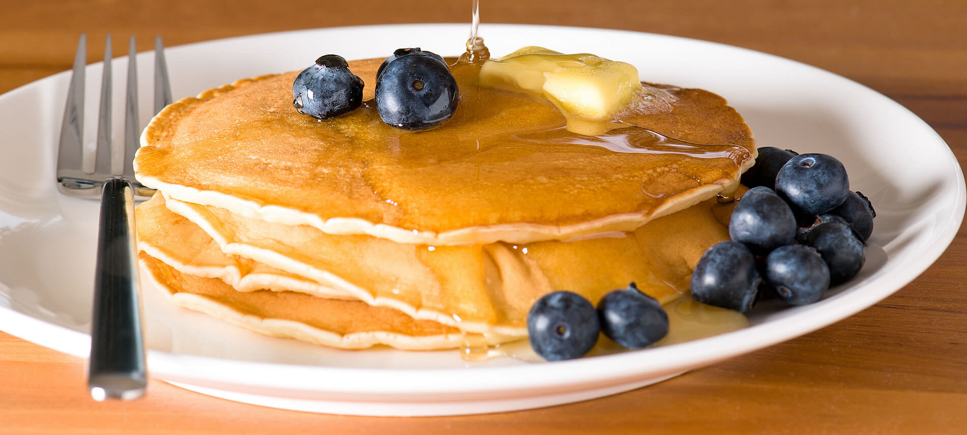 golden pancakes with blueberries on top