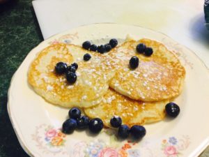 Three pancakes on a china plate
