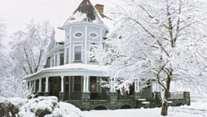 The front of the Whistling Swan Inn covered in beautiful ice and snow